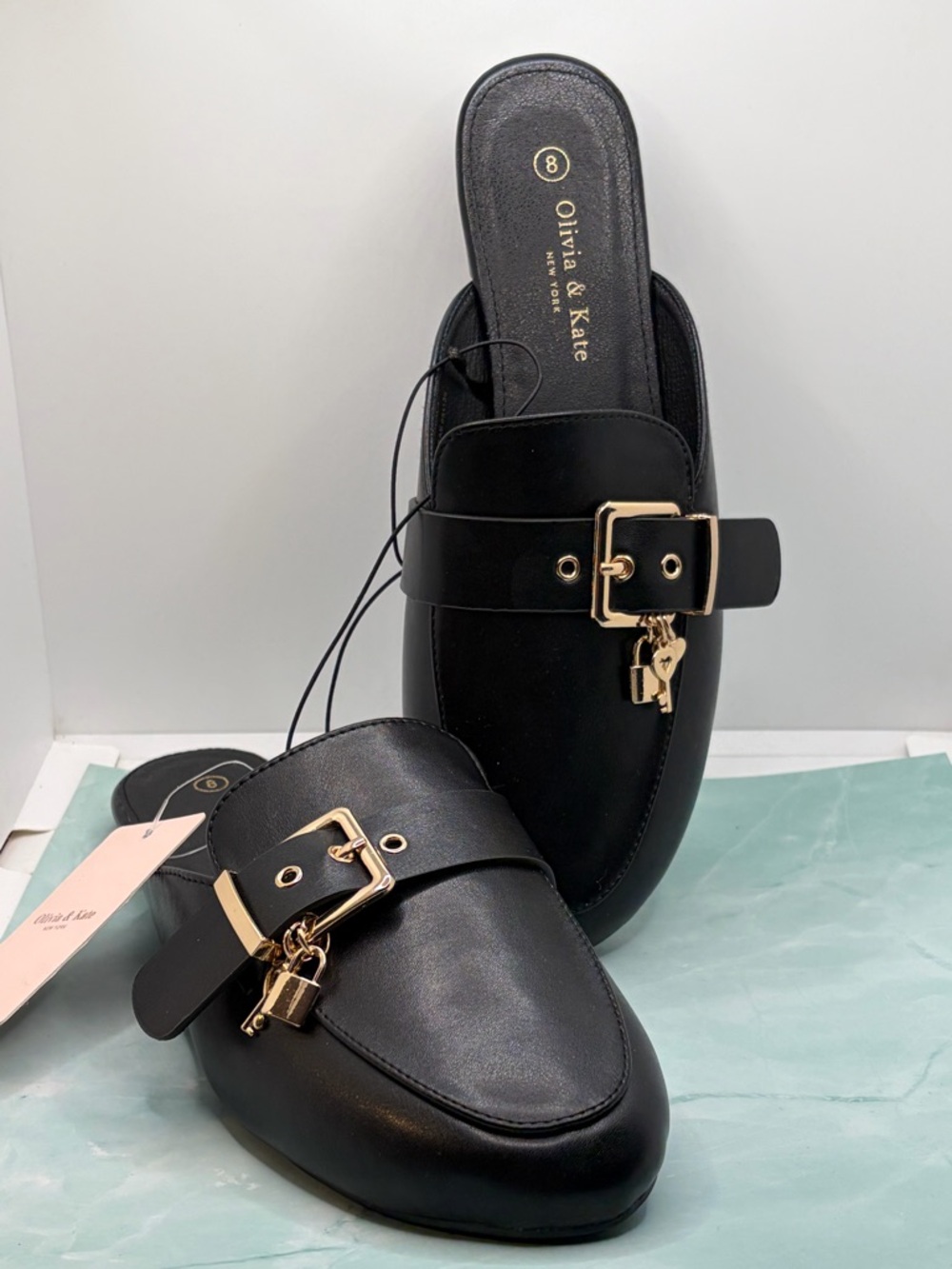 Olivia& Kate Black Leather Slip-On Mules with Gold Buckle and Padlock Charms
